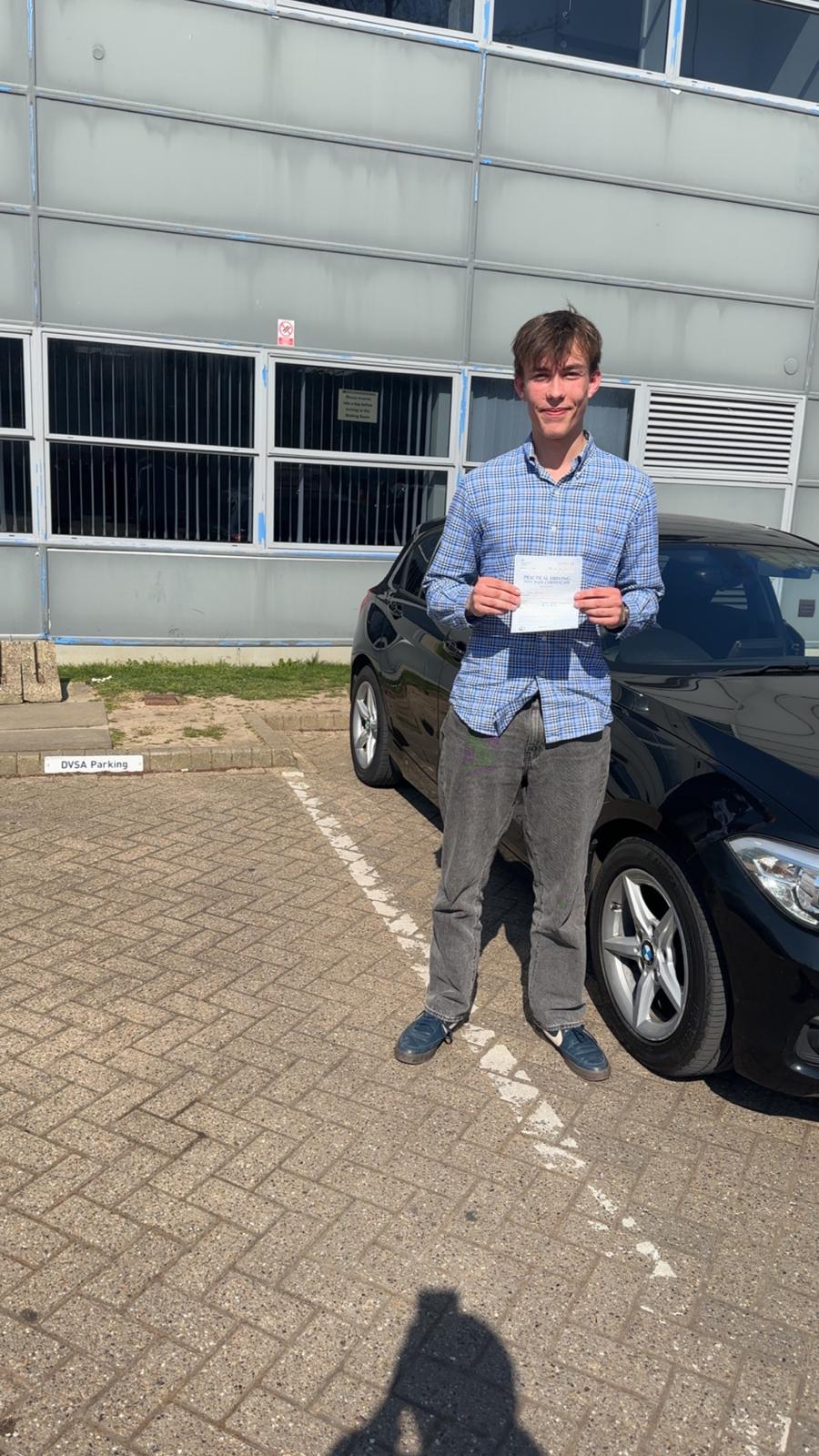 Passed student 1 celebrating their driving test success